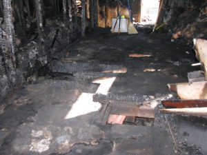 A room that has been burned and is in the middle of it.