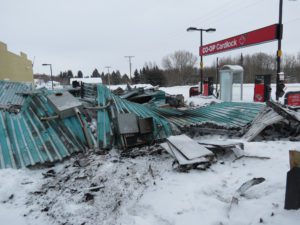 A pile of debris is shown in the snow.